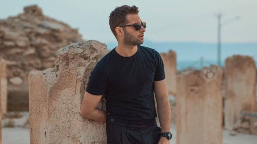 Man taking a quiet moment to reflect on his emotional state alone 