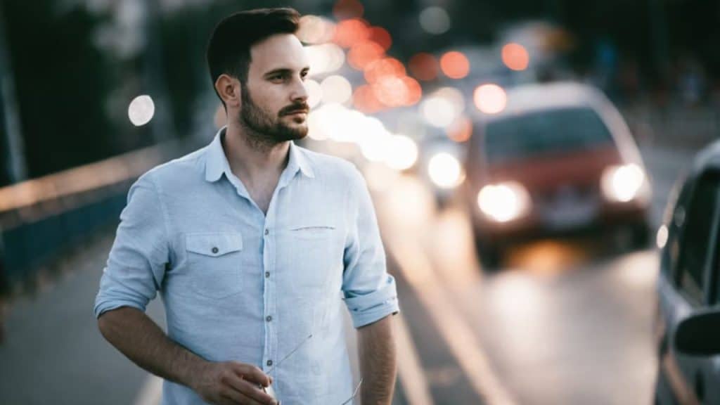 Man reflecting during an evening walk, mentally checking in with himself