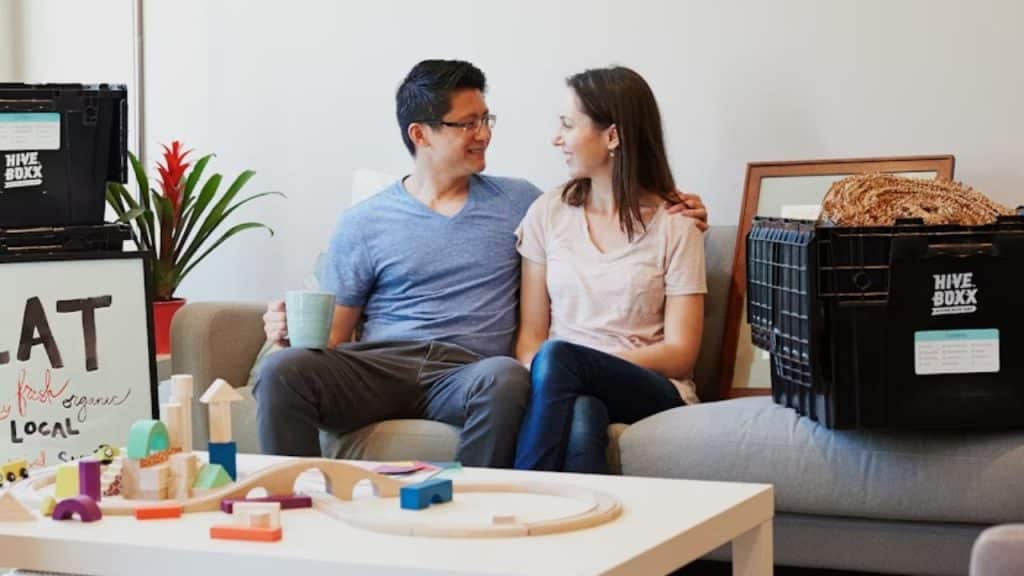 Couple discussing future plans together in a calm living room setting