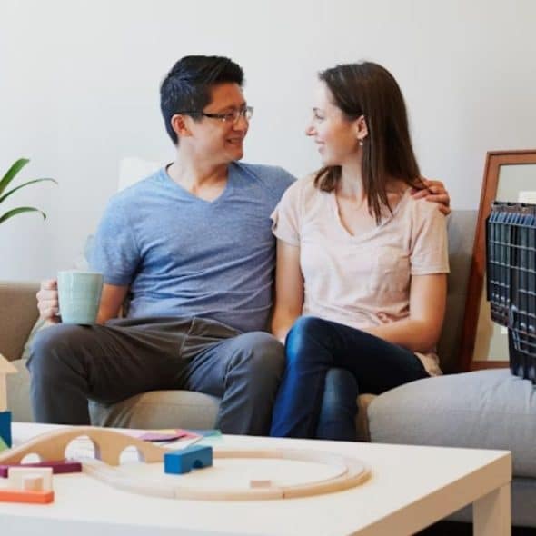 Couple discussing future plans together in a calm living room setting