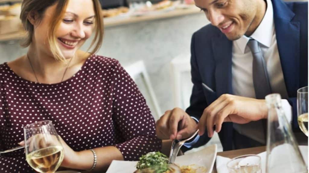 Couple bonding over favorite foods during a relaxed dinner date