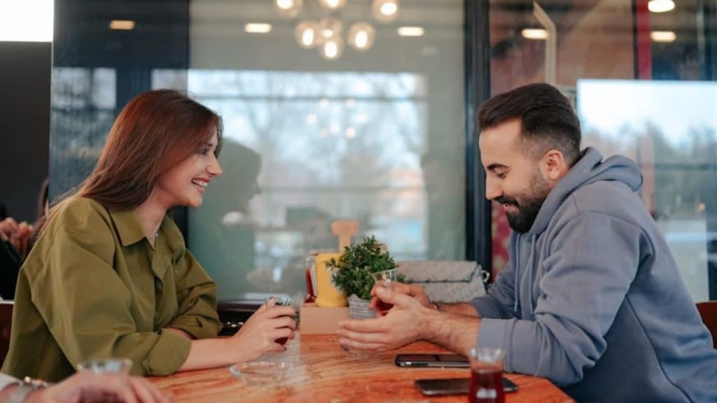 Couple chatting while their phones are face down on the table