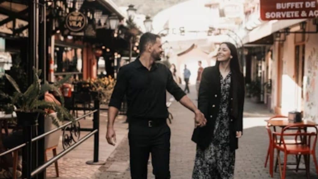 Couple exchanging creative ideas while walking through a local market