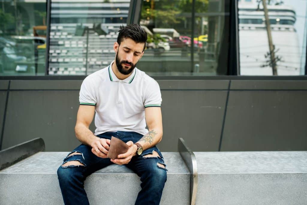 A man checking his wallet.