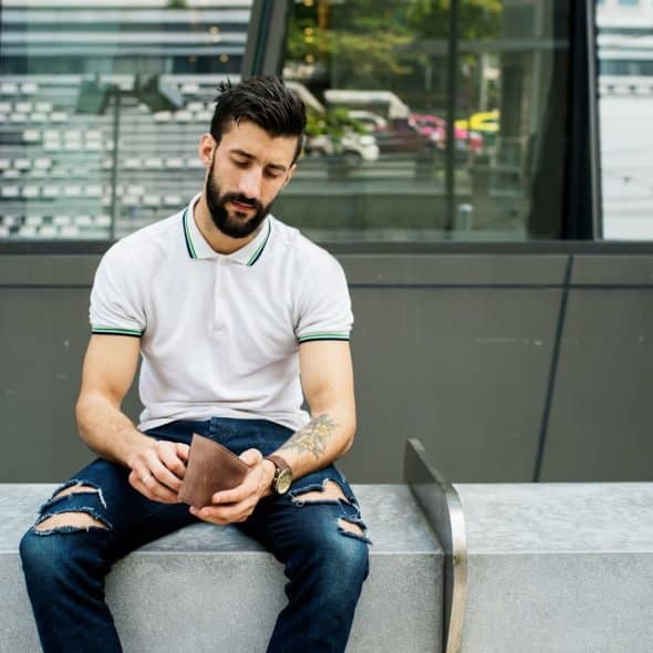 A man checking his wallet.