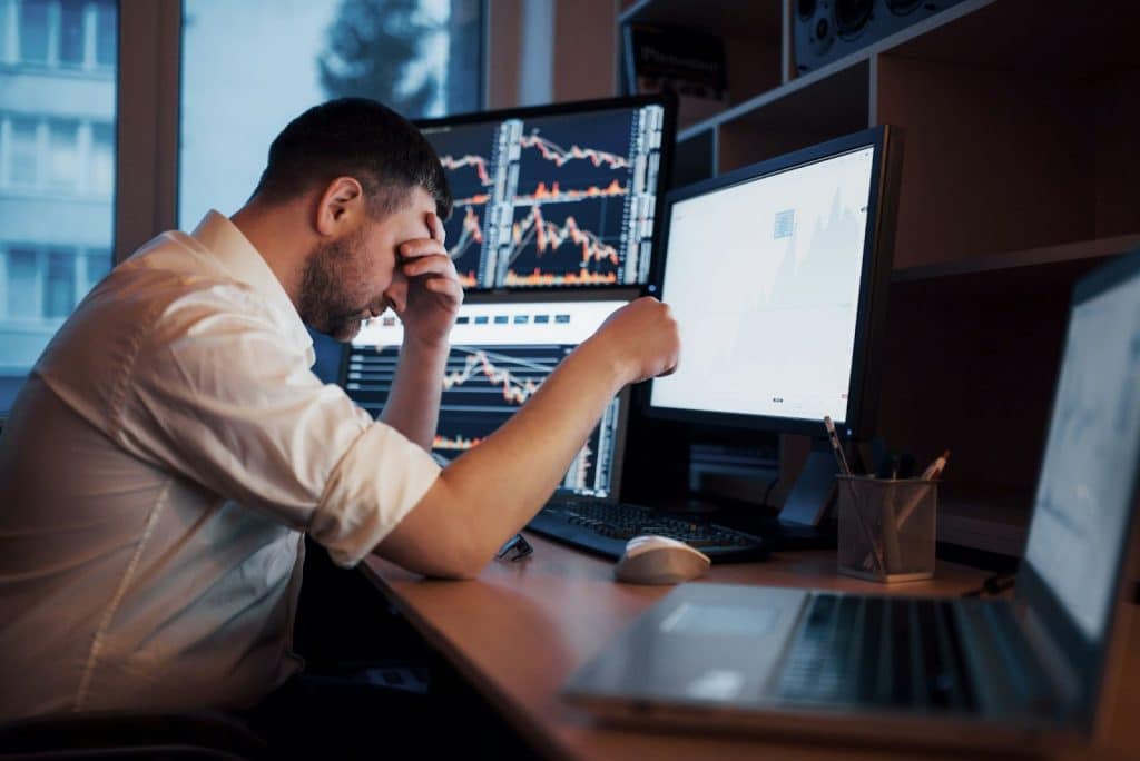 A man disappointed with the result of investment.