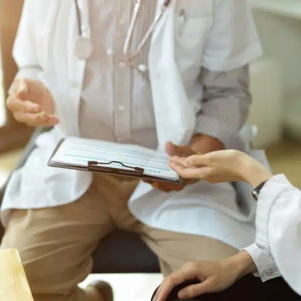 Two doctors discussing about something.
