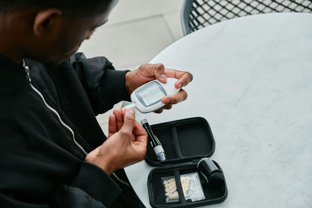 A man checking his glucose level.