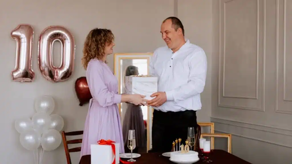 Couple celebrating their anniversary in a warm, personalized setting filled with meaningful details.