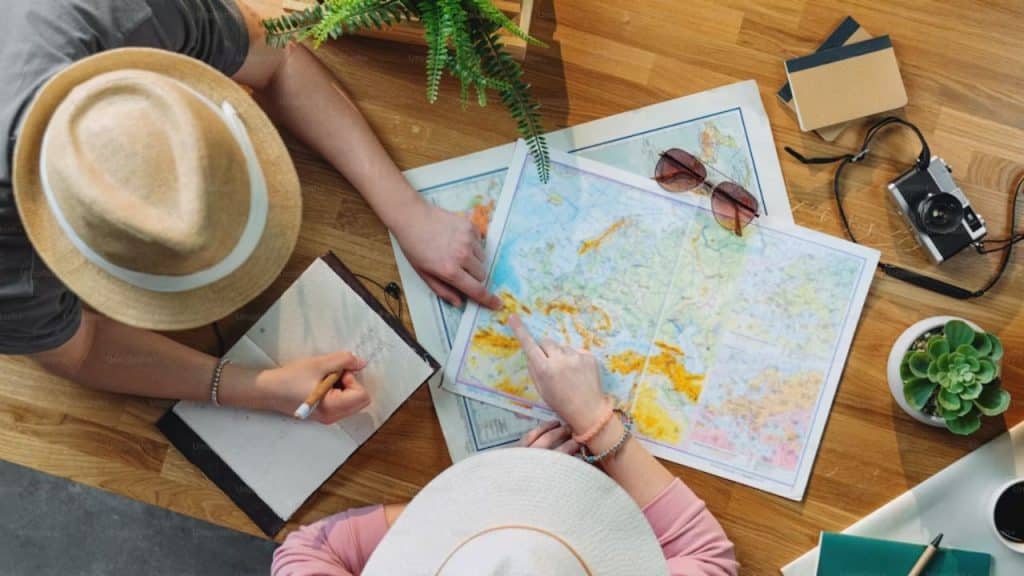 Couple planning a trip mapping as part of their anniversary celebration.