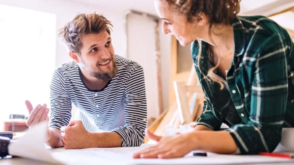 Couple planning their shared bucket list to celebrate their anniversary meaningfully.