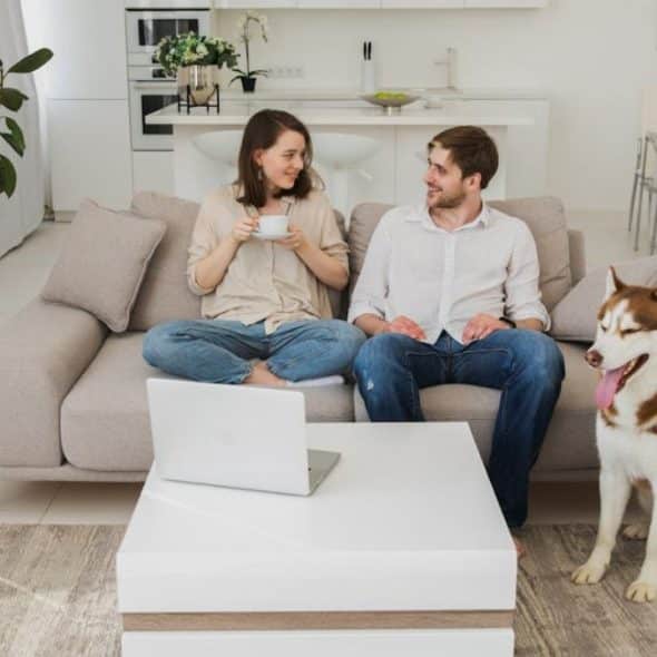 A man and woman having a calm and respectful conversation in the living room.