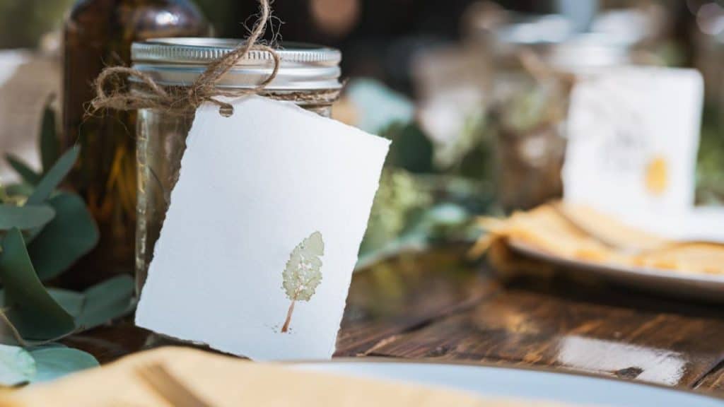 A creative mason jar filled with paper where couples draw surprise date activities together.