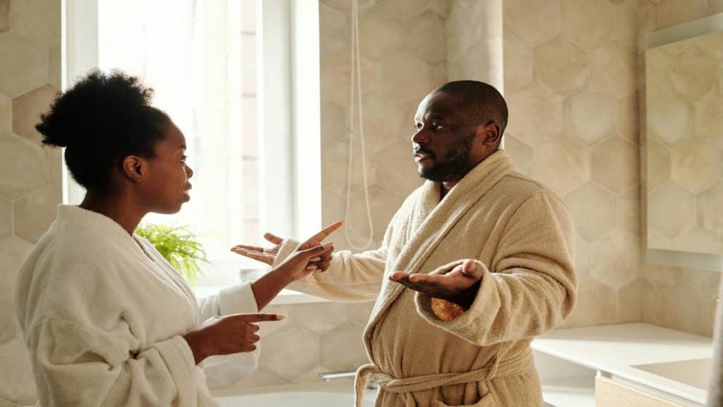 A couple arguing in the bathroom.