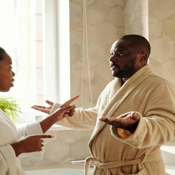 A couple arguing in the bathroom.