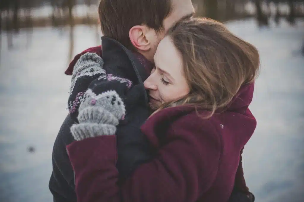 A man and woman hugging each  other