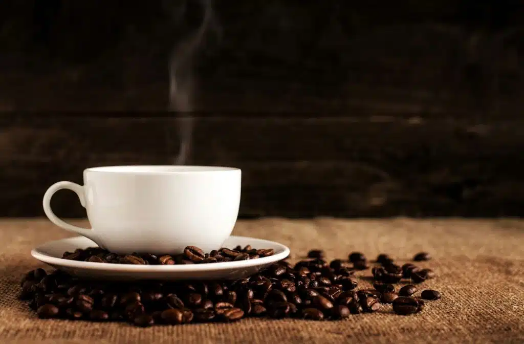 A picture of coffee and a coffee beans 
