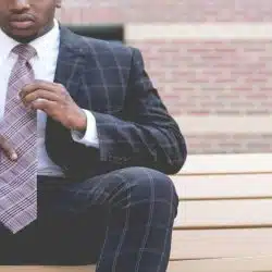 A man wearing plaid suit