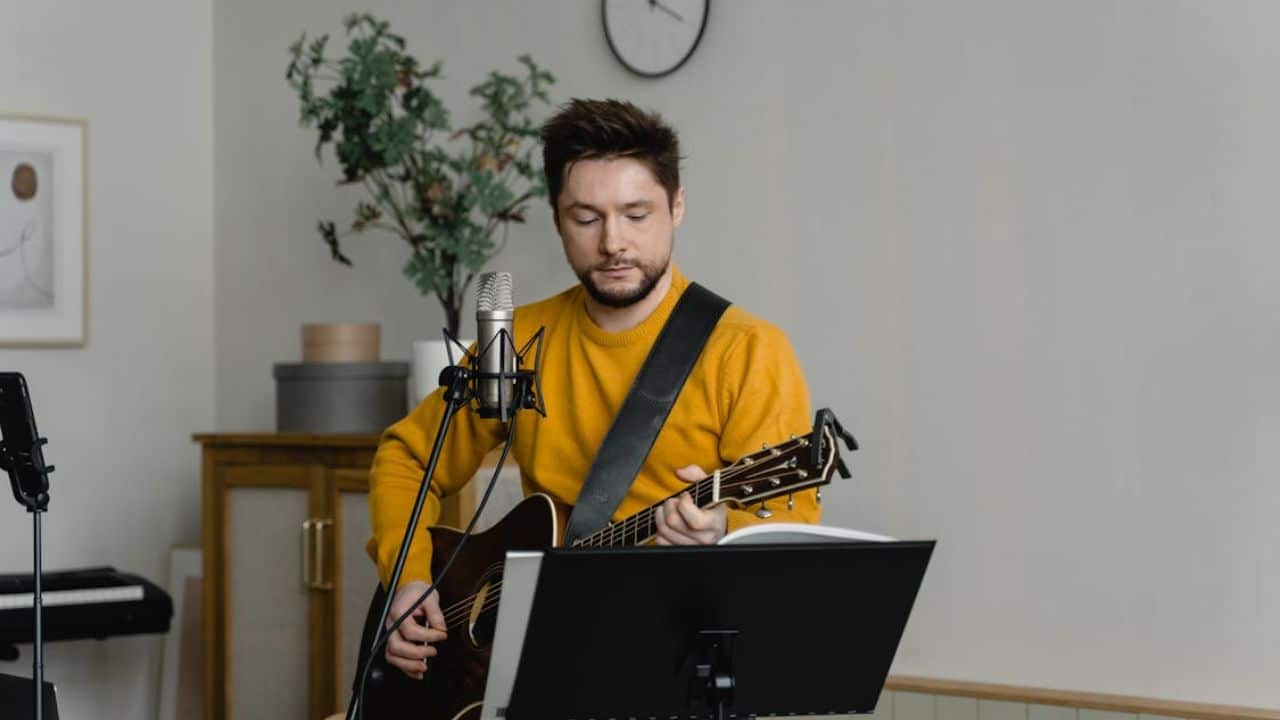 Man happily engaged in a solo hobby like playing music.
