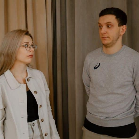 Man in doubt and paying close attention to his partner’s body language during a serious talk.