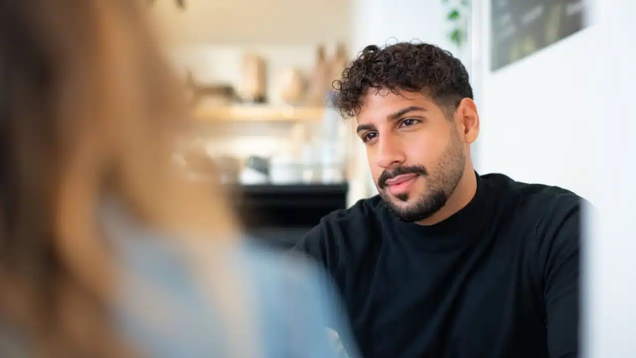 Man sensing something off in a partner’s unusual communication pattern.