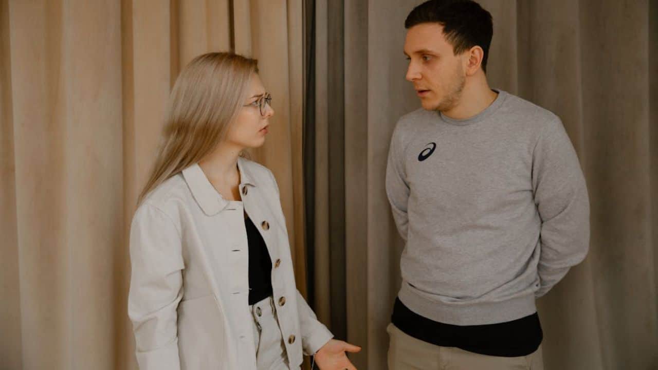 Man asking the woman calmly about concerns and truth in the relationship.