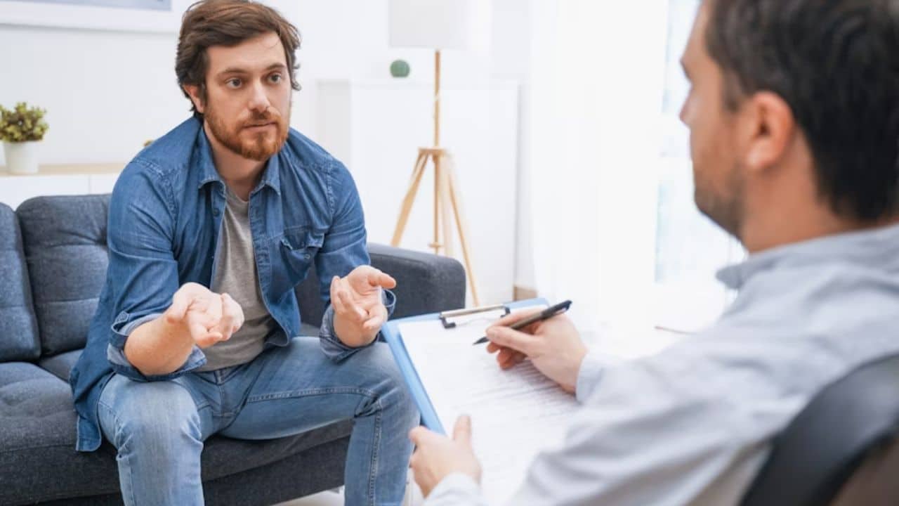 Man talking to a therapist for his emotional and mental  well being.