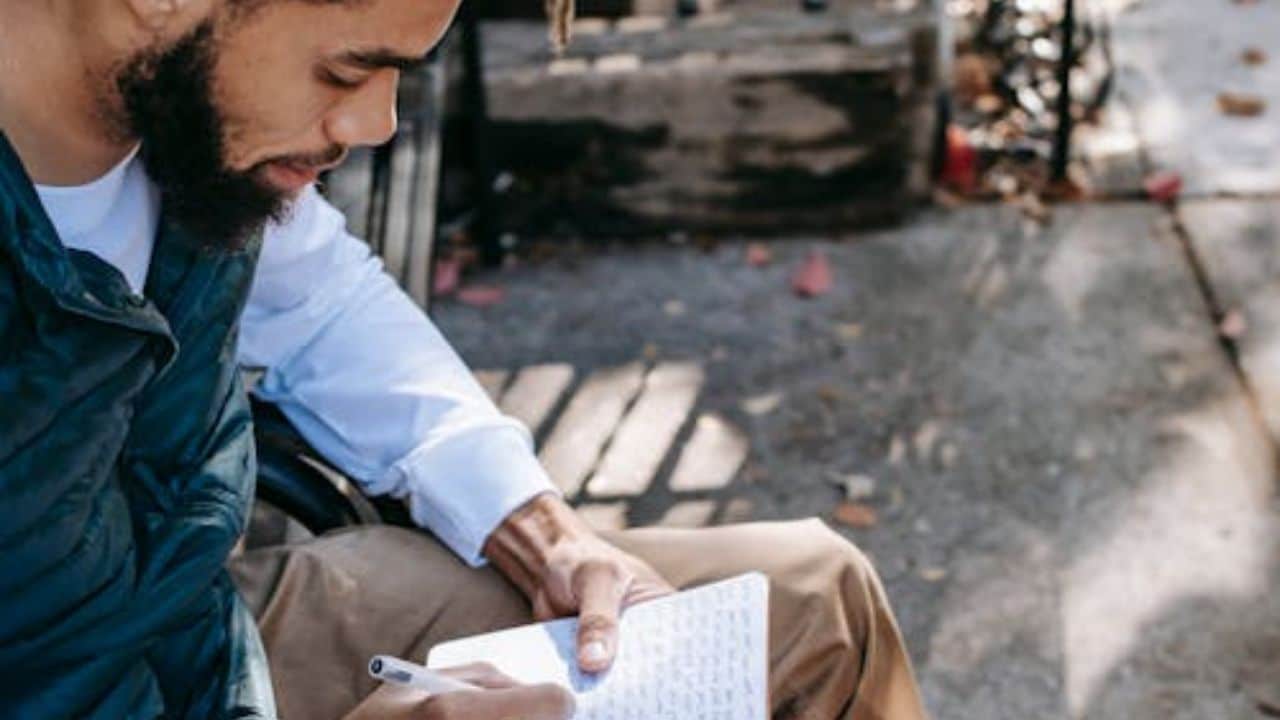 Man doing journaling after a tough day.