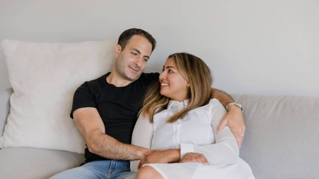 Couple relaxing at home, chatting and feeling emotionally safe with each other.