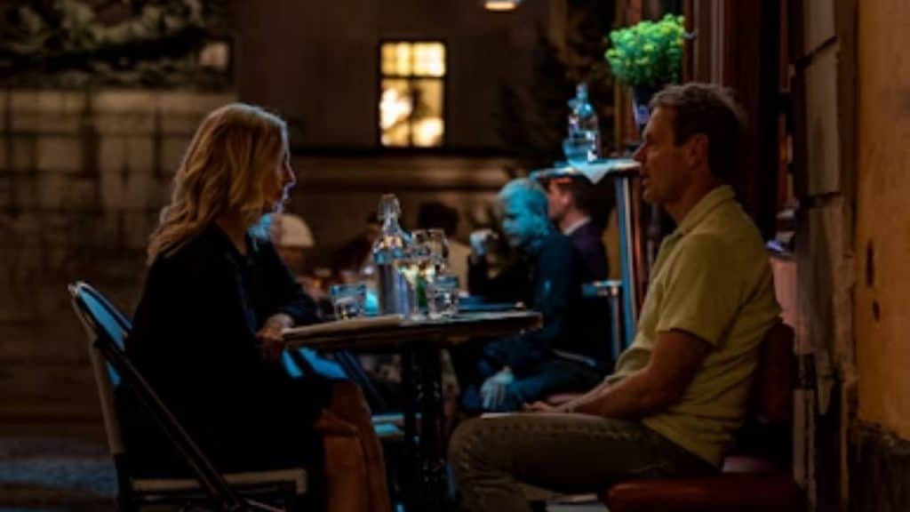 Man attentively listening as his date reflects honestly on her past.