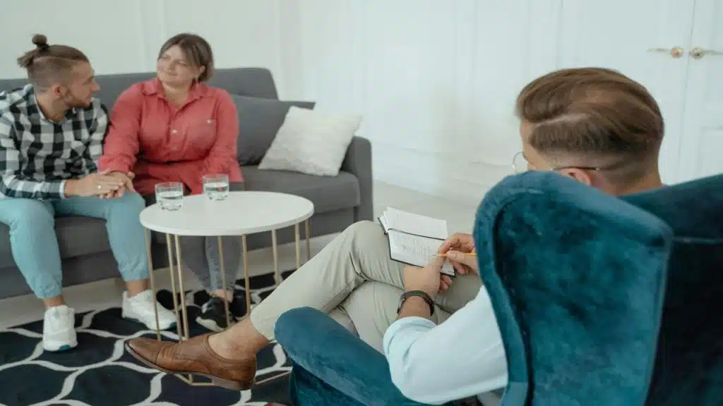 A couple during a session with a therapist.