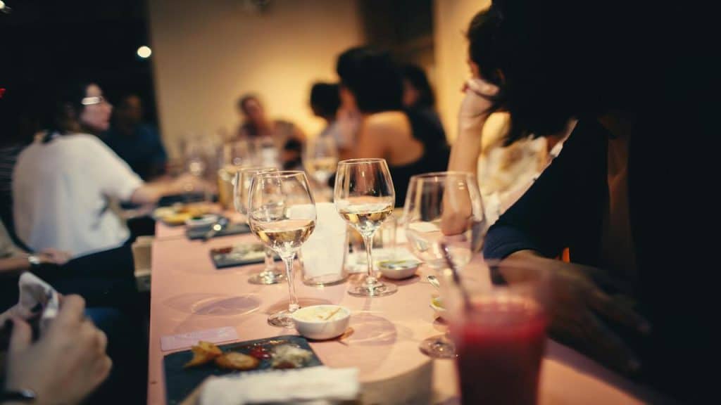 People having wine at a restaurant.