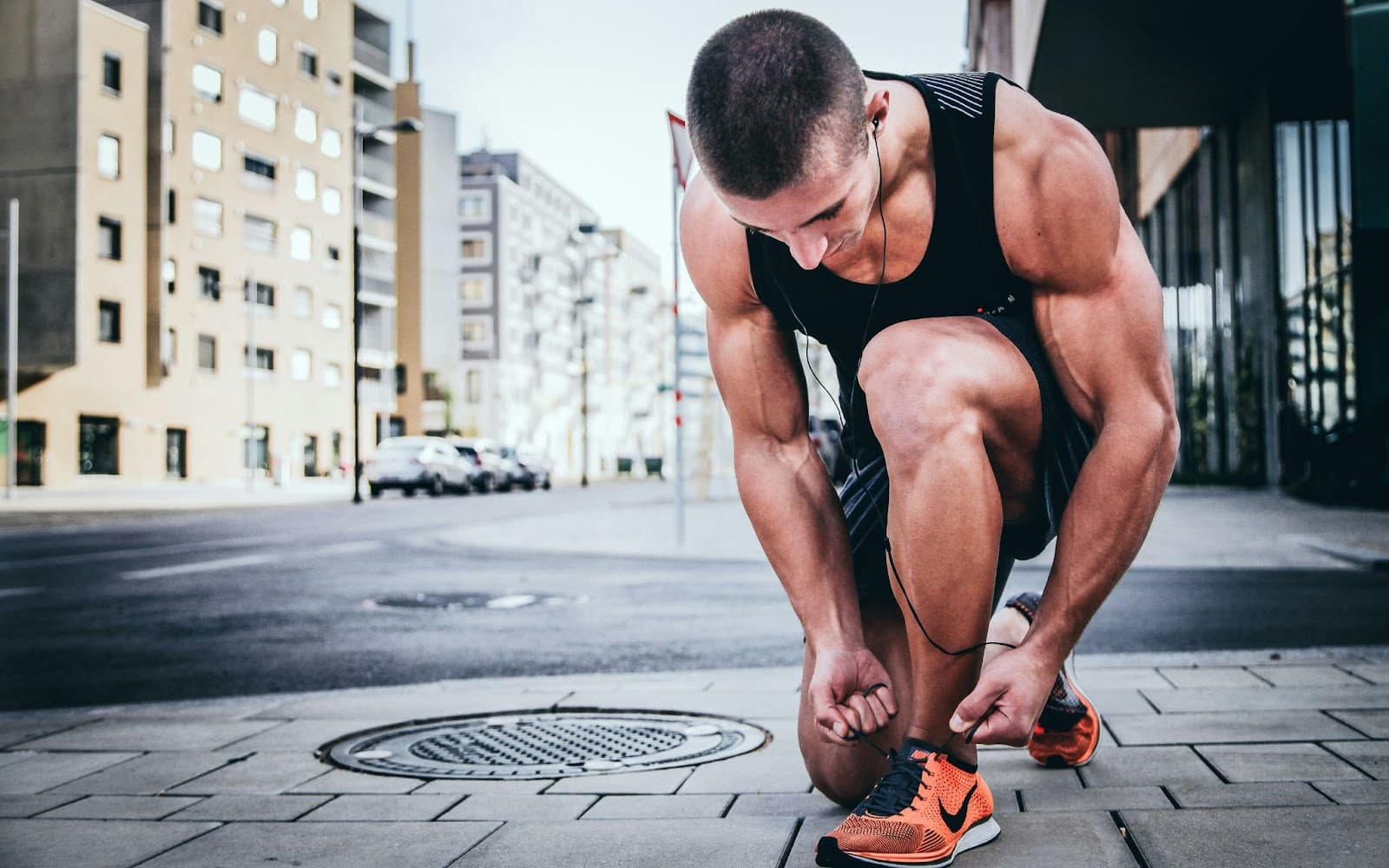 A man tying his shoes.