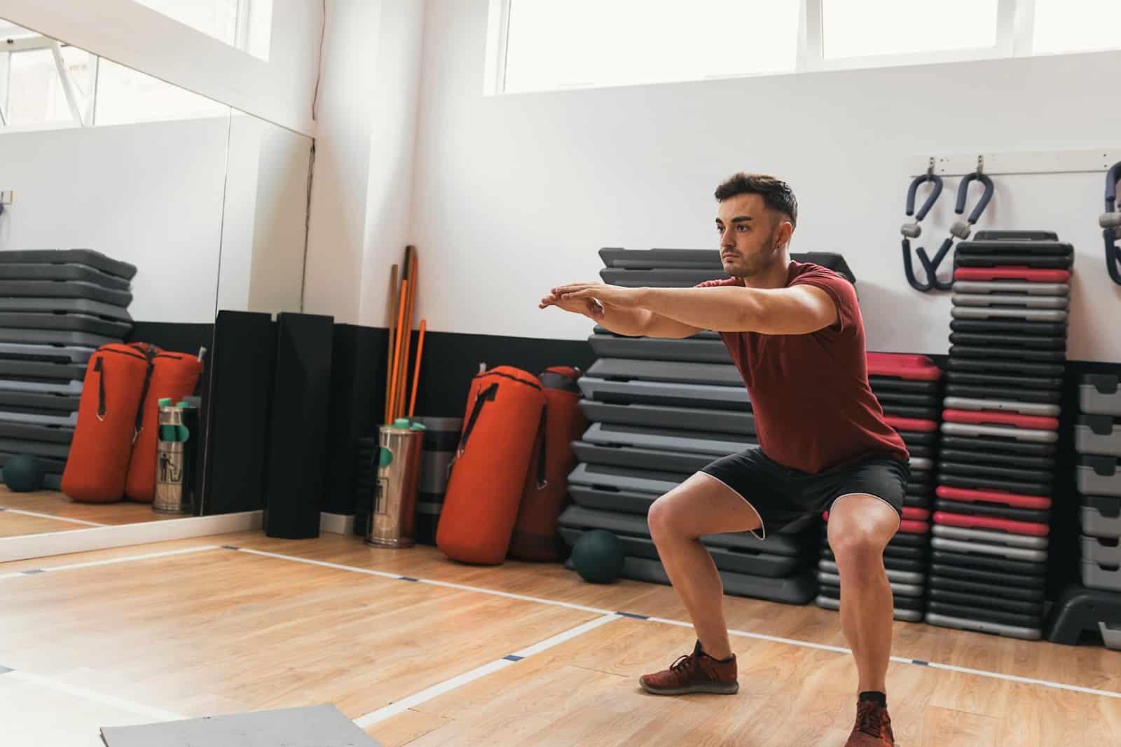 A man doing a squats.
