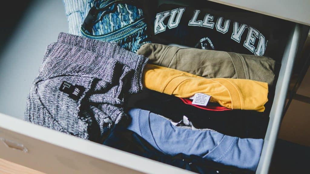 Folded shirts in drawer.