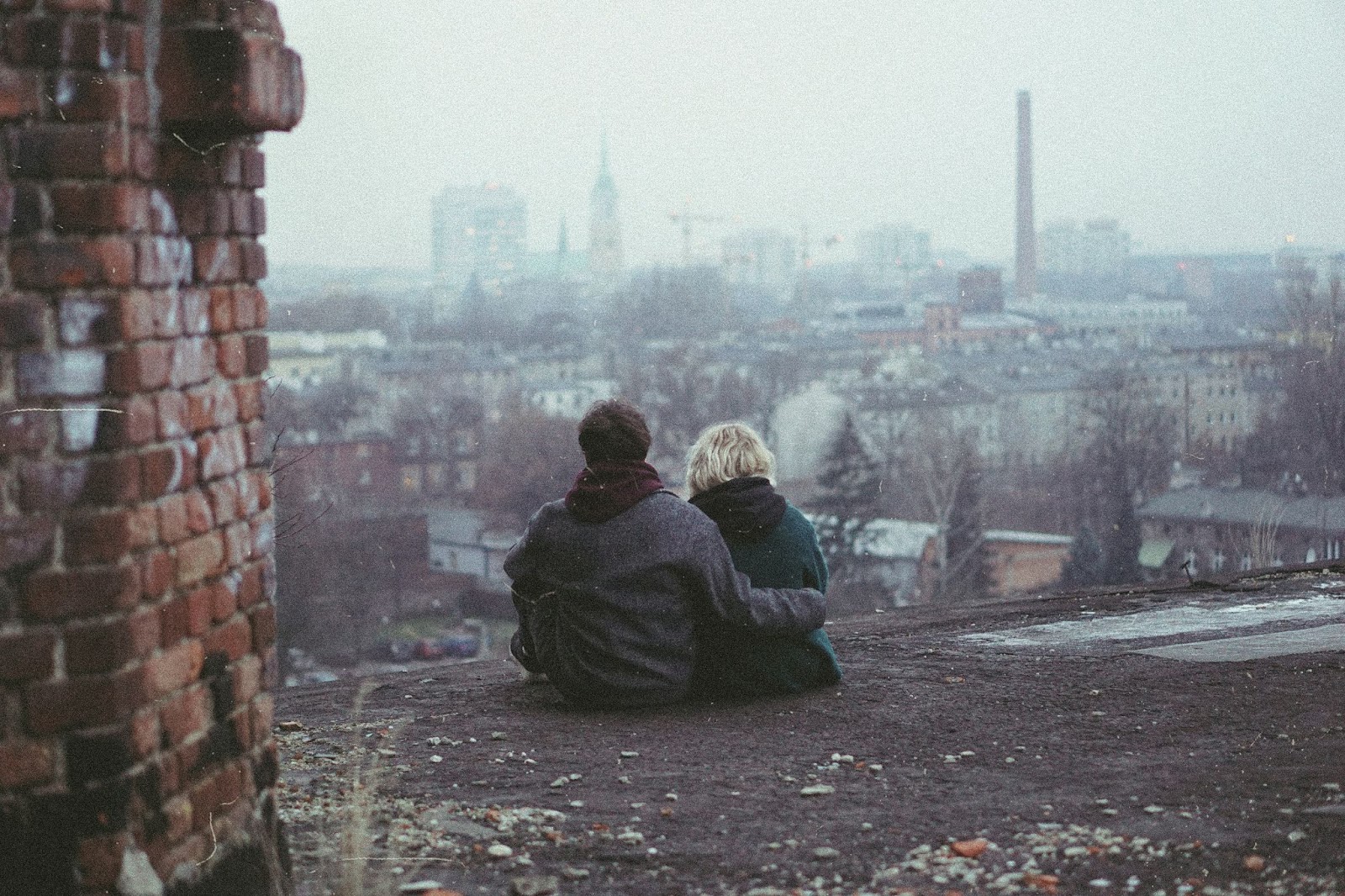 A man hugging a woman.