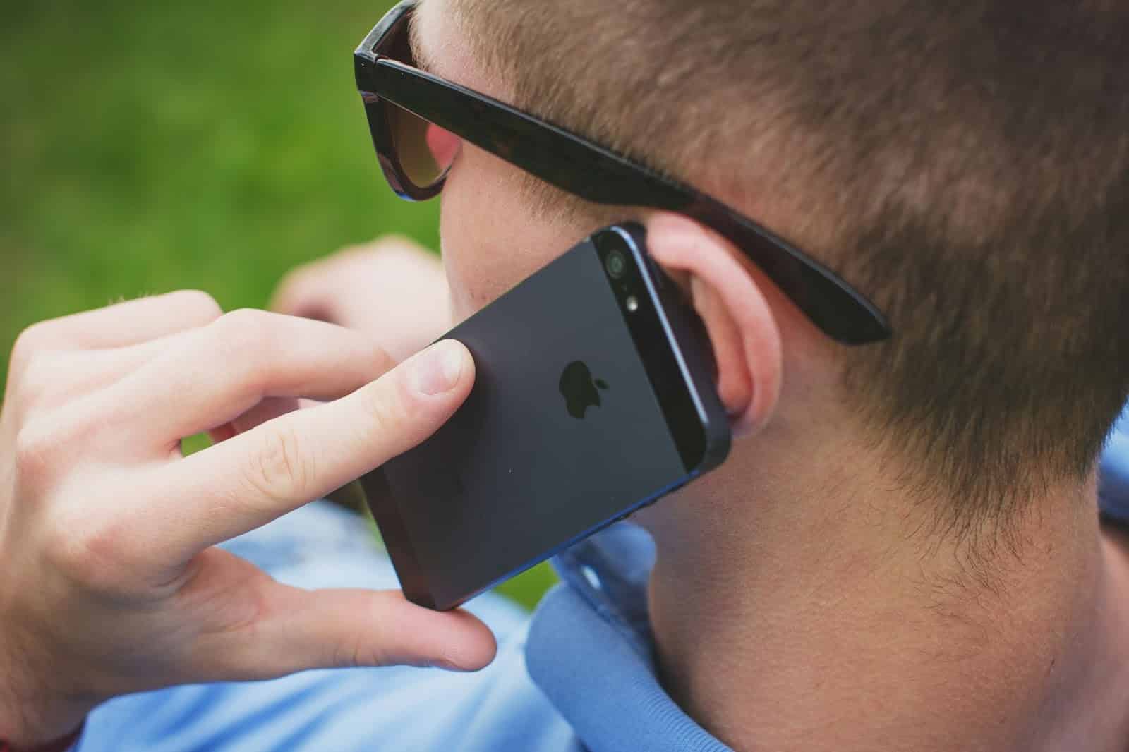 A man calling someone on phone.