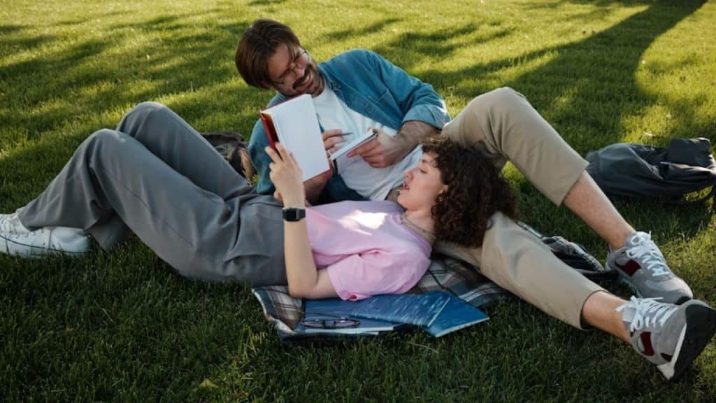 Couple reading together in the park