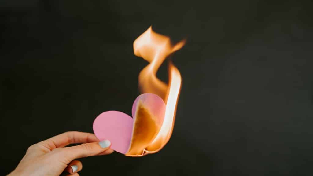 A heart paper on fire.