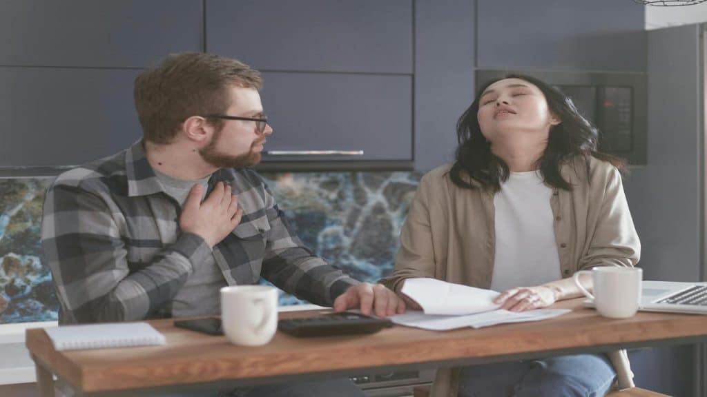 A couple looking at their bills