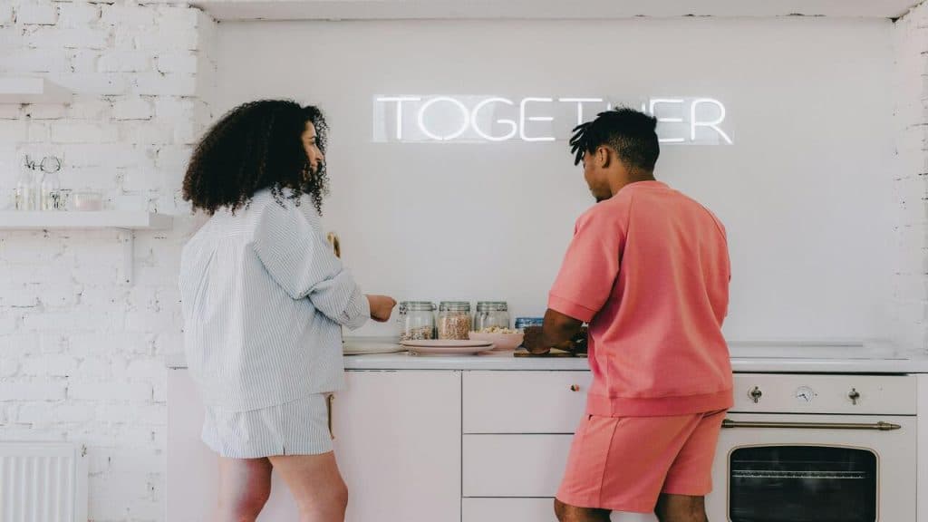 A couple cooking in the kitchen