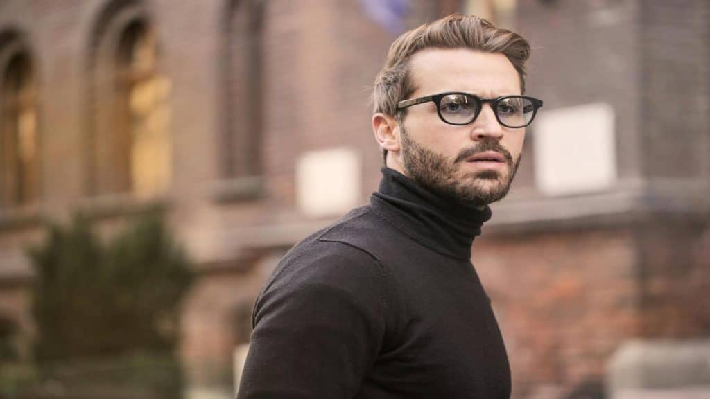 A man wearing a black turtleneck