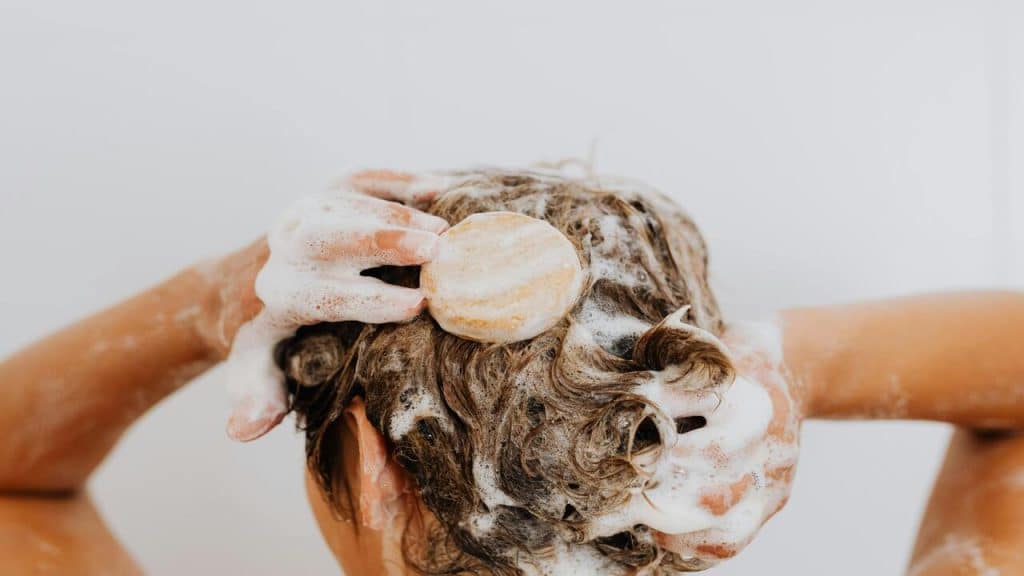 A man using a shampoo bar