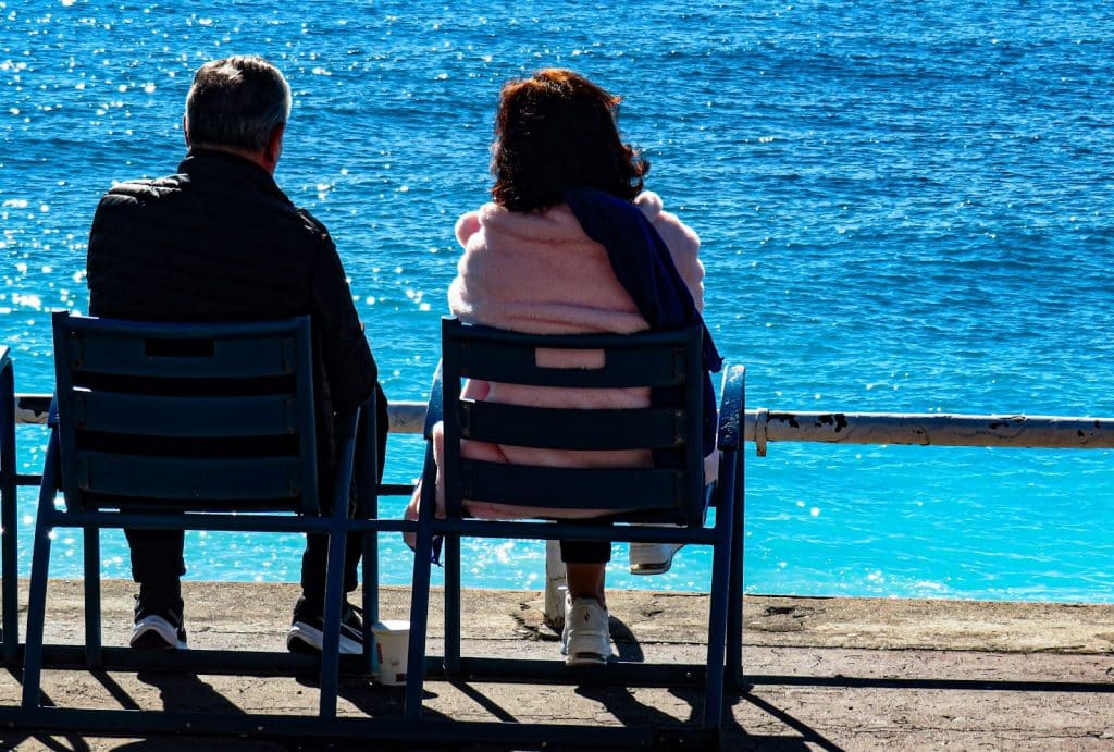 A man and woman sitting beside each other