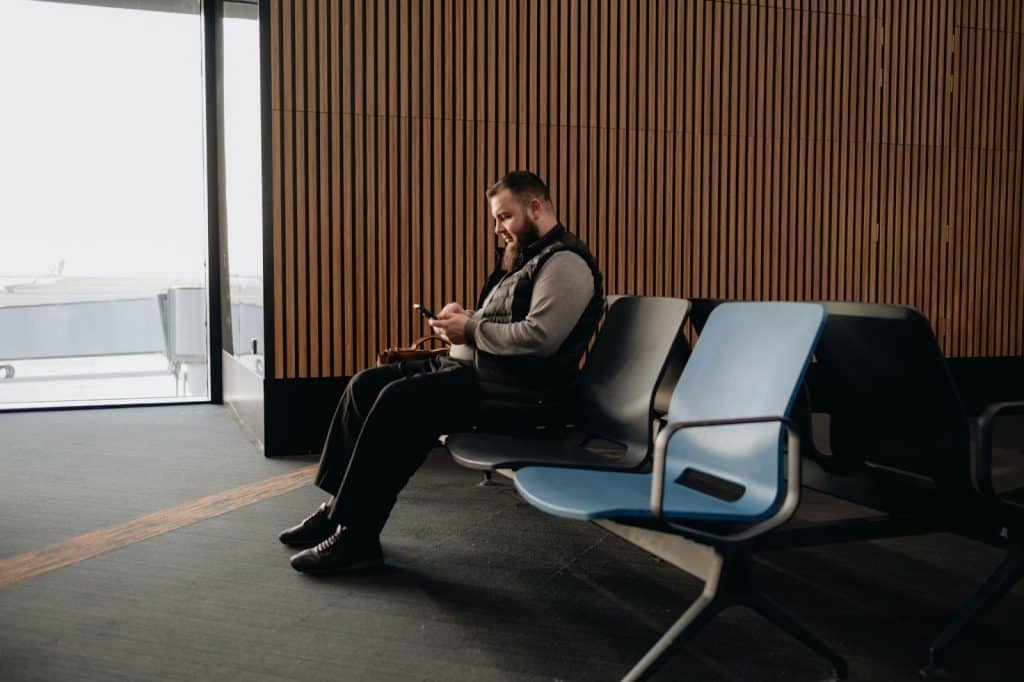 A man sitting on a waiting area