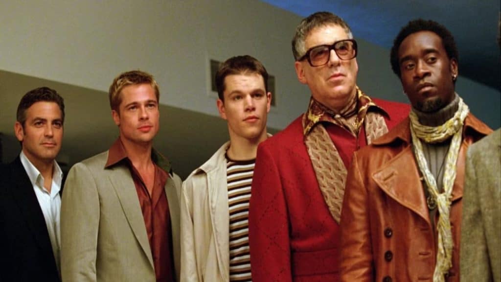 A group of men looking at the same person.