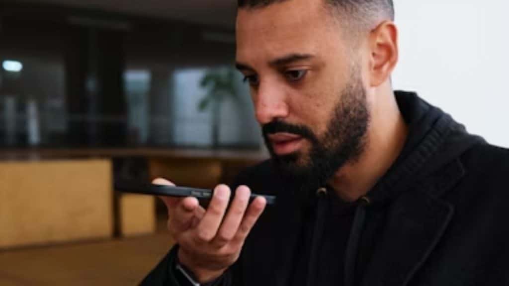 Man feeling emotional after listening to a voice note from his partner.