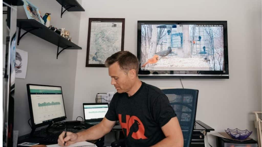 Man at his desk journaling a personal goal.