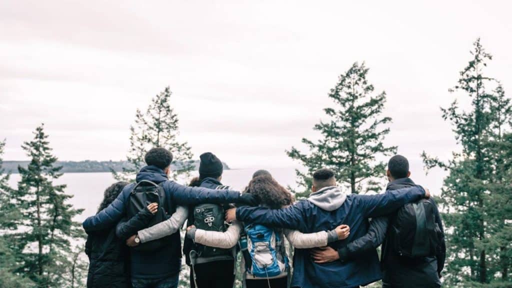 Group of coworkers outdoors hiking.