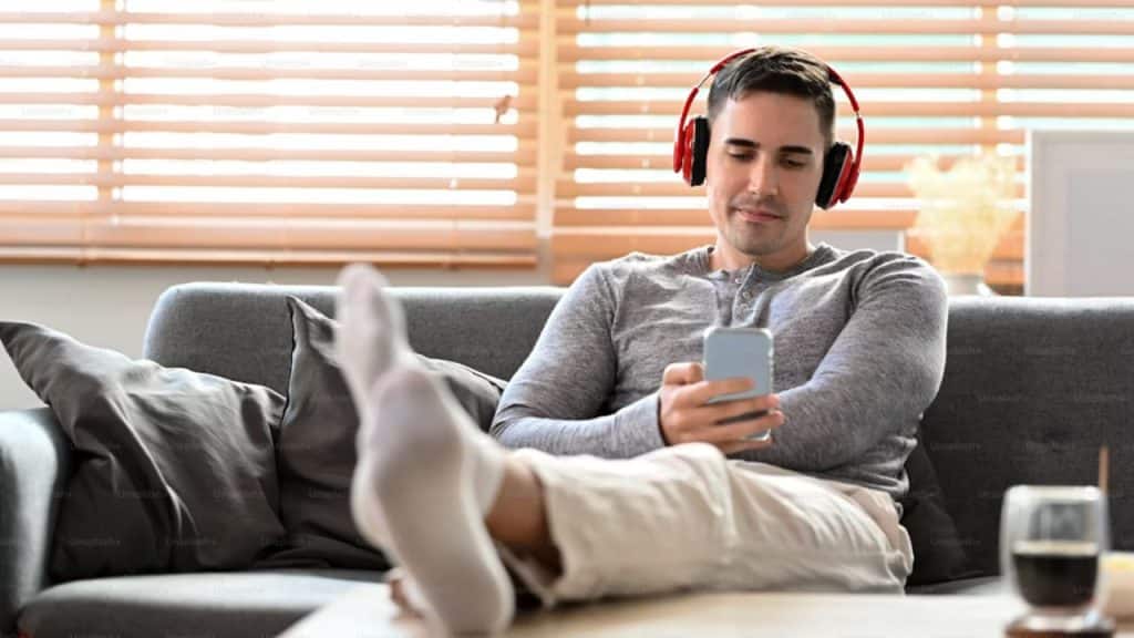 Man listening to music with a relaxed expression.